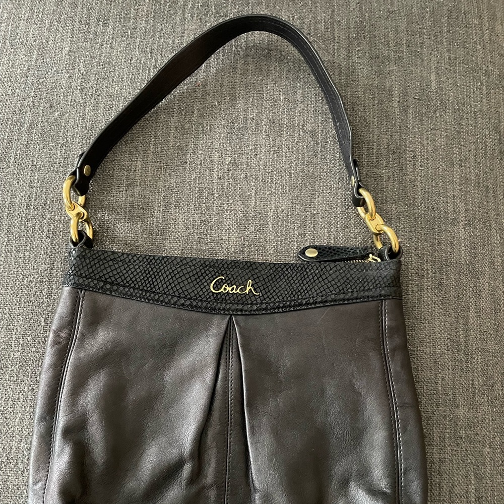Black Coach with snake print detail